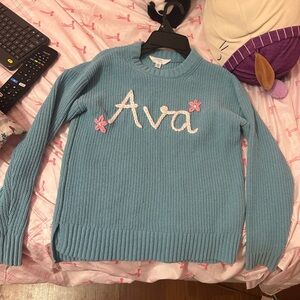 Blue Sweater with White and Pink Accents